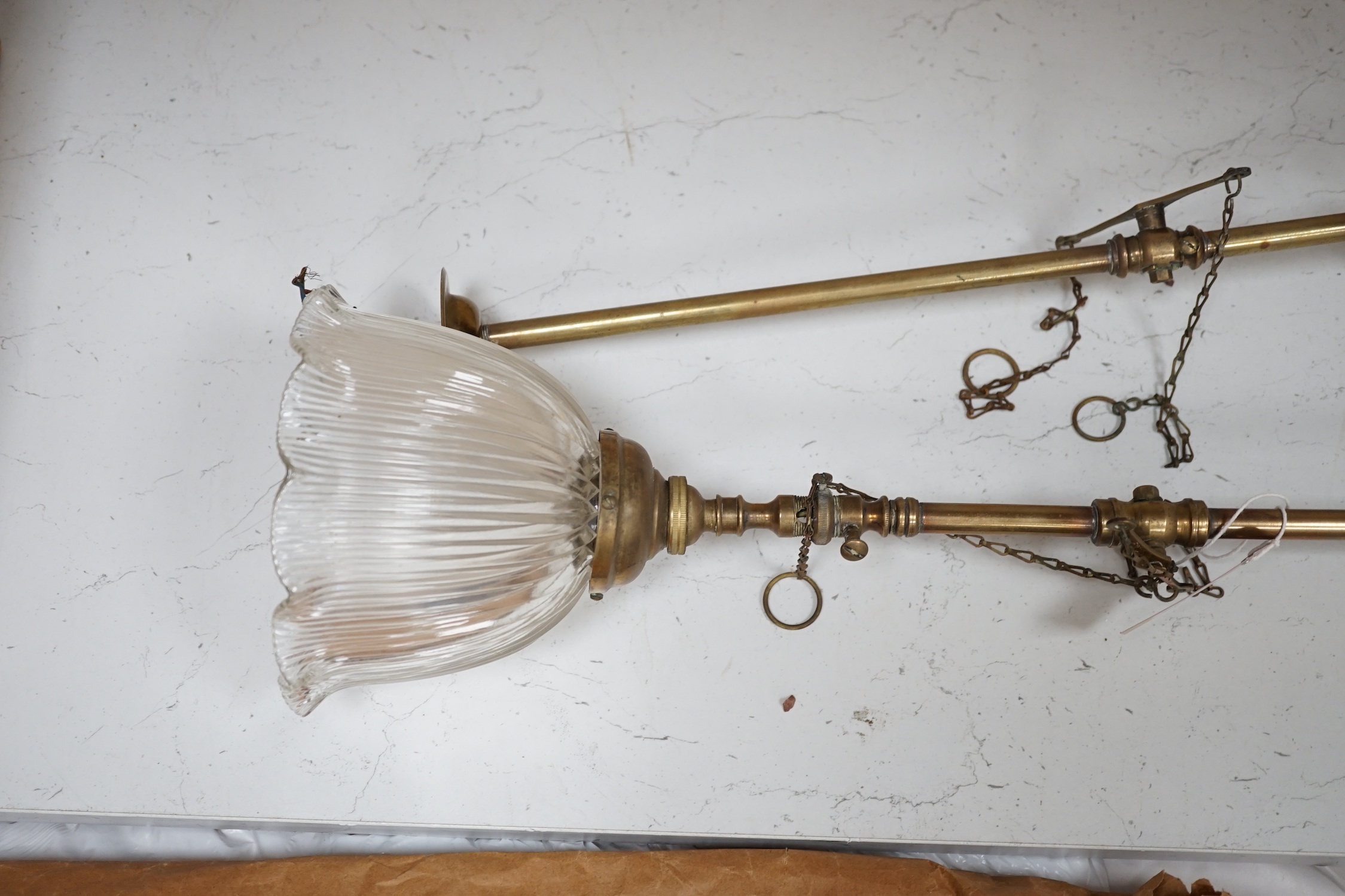 A pair of Victorian brass gas lights, converted to electric